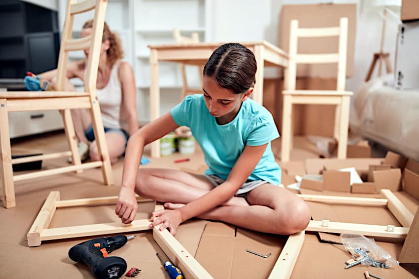 Child Assembling Wooden Chairs