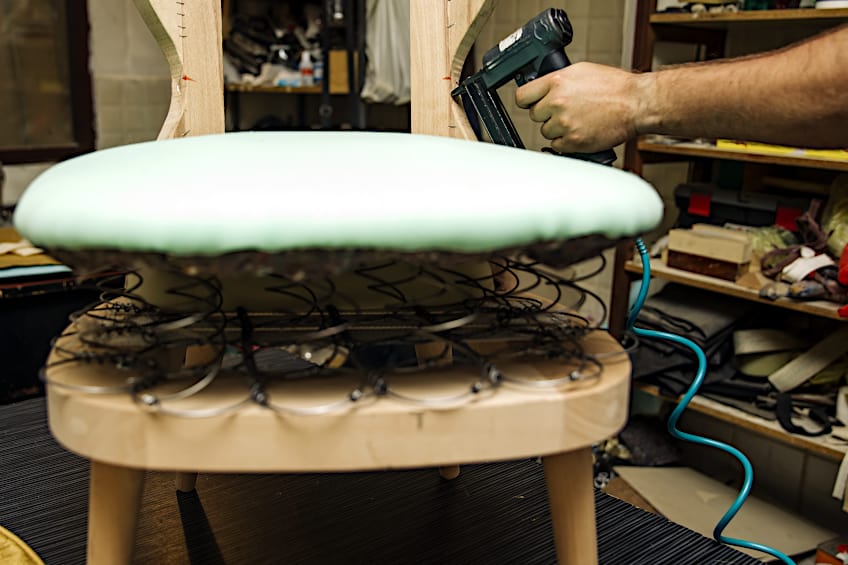 Upholsterer Using Air Nailer