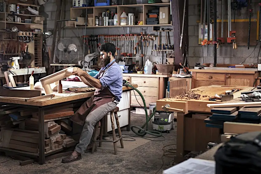 Joiner Seated at Workbench